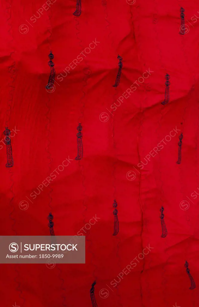 Ghana, Ashanti , Close Up Of Traditional Red Ashanti Funeral Cloth With Pattern Of Swords.
