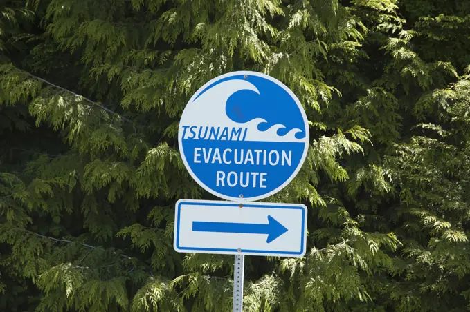 Canada, British Columbia, Vancouver Island, Tsunami warning sign indicating evacuation route, close to Tofino.
