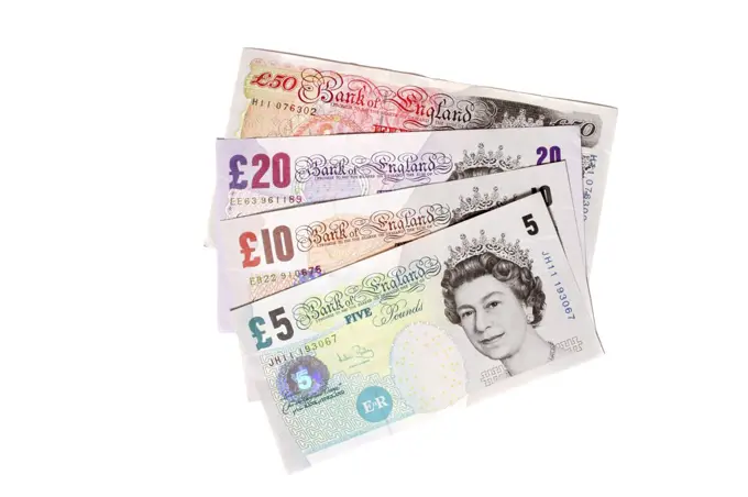 Business, Finance, Money, English sterling currency. Five  ten  twenty and fifty pound notes fanned out on white background.