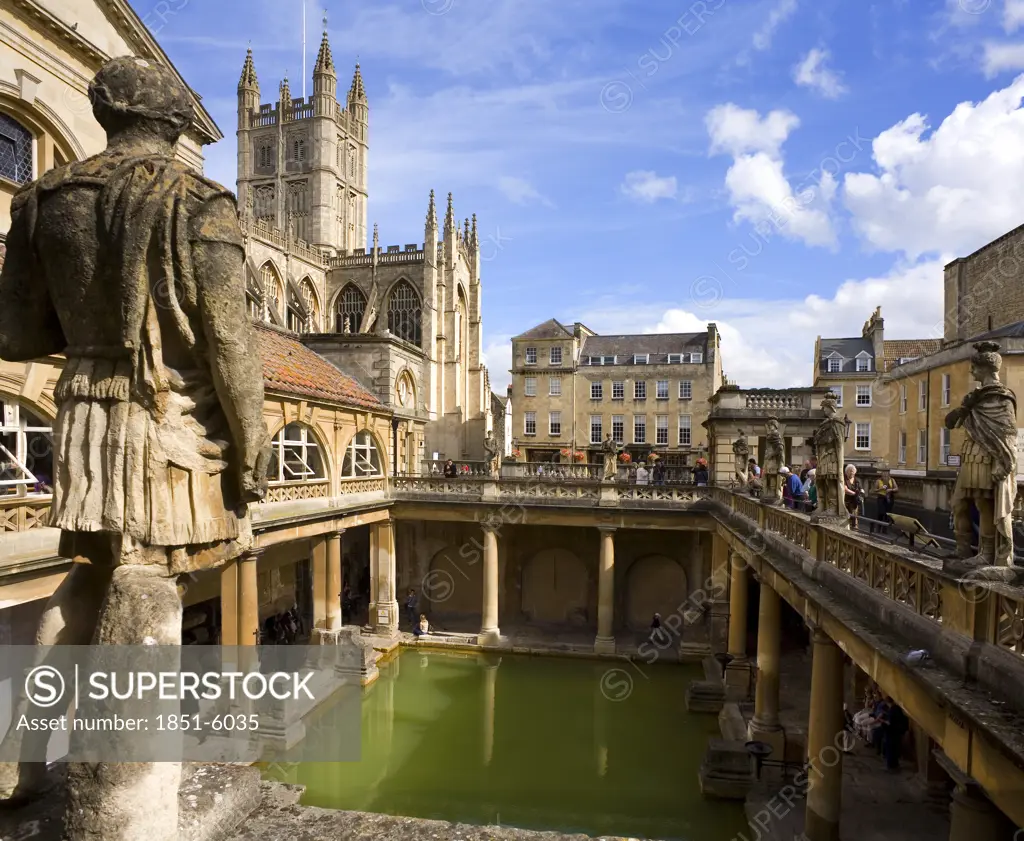 The ' Roman Baths'  at Bath, England. A wide angle view with Centurions and Bath Abbey . 