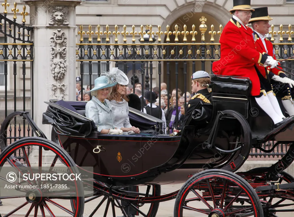 Camilla Parker Bowles Duchess of Cornwall and Kate Middleton Duchess of  Cambridge with Prince Harry , leave Buckingham Palace in royal coach for Ceremony of Trooping the Colour June 2012