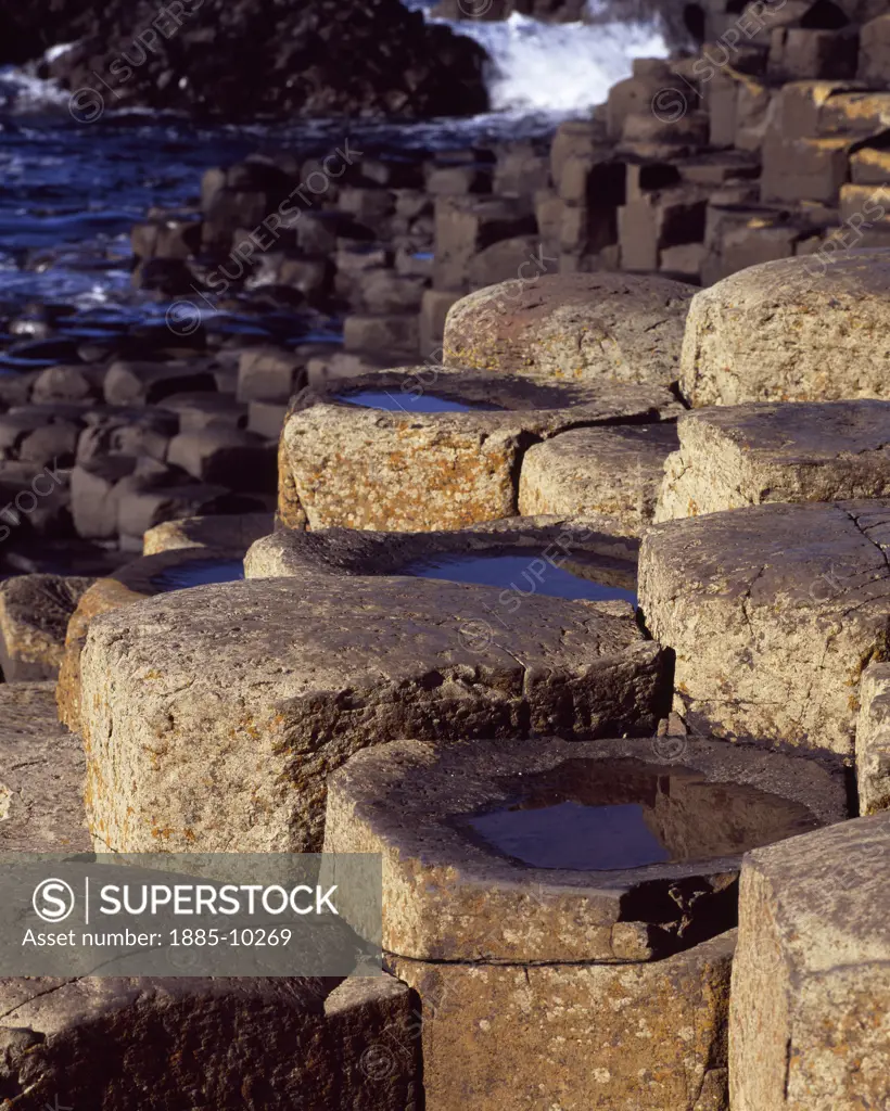 UK - Northern Ireland, County Antrim, Giants Causeway, Basalt rock columns in sea