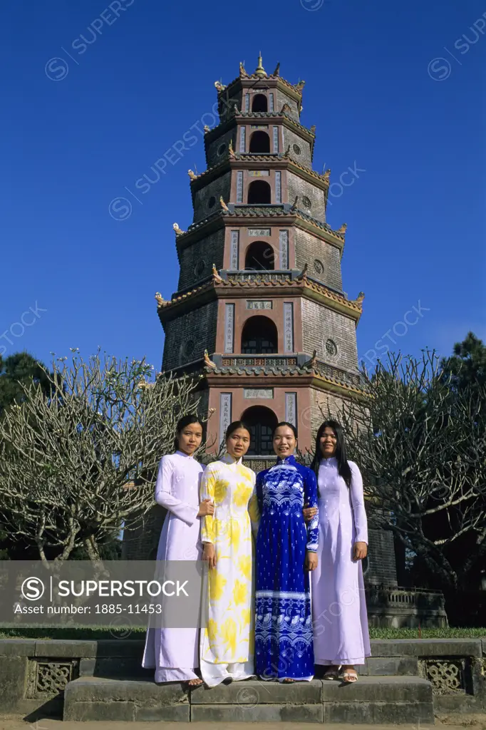 Vietnam, , Hue , Thien Mu Pagoda with four traditionally dressed girls