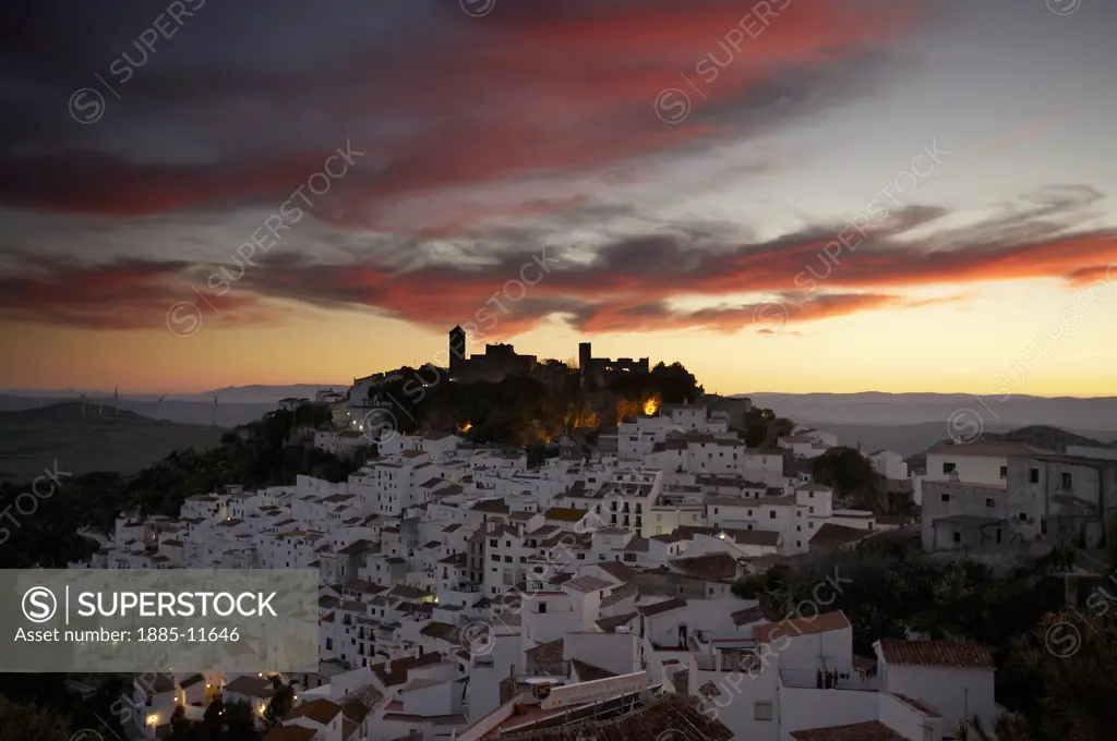 Spain, Andalucia, Casares, View over white hill town at sunset