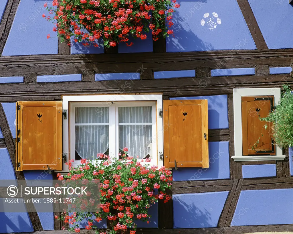 France, Alsace, Duttenheim, Half timbered house with window boxes