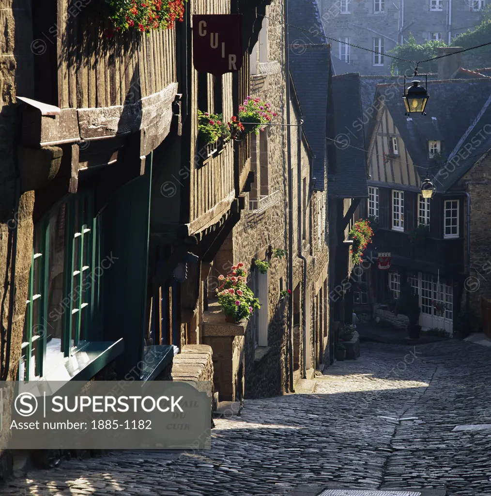 France, Brittany, Dinan , View down steep cobbled street