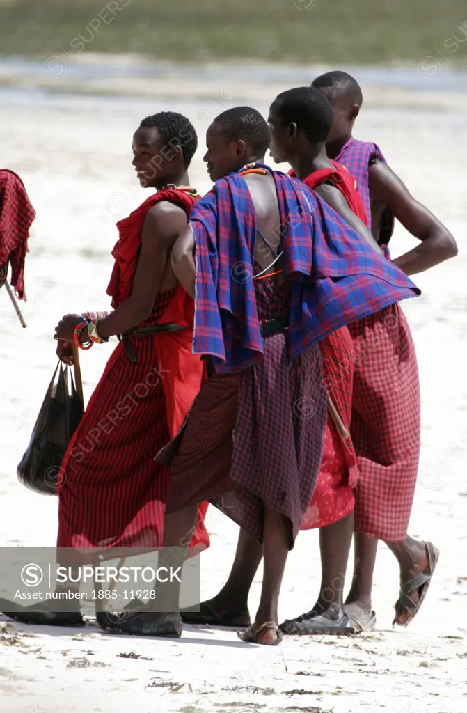 Kenya, , Malindi, Group of young Masai men on beach
