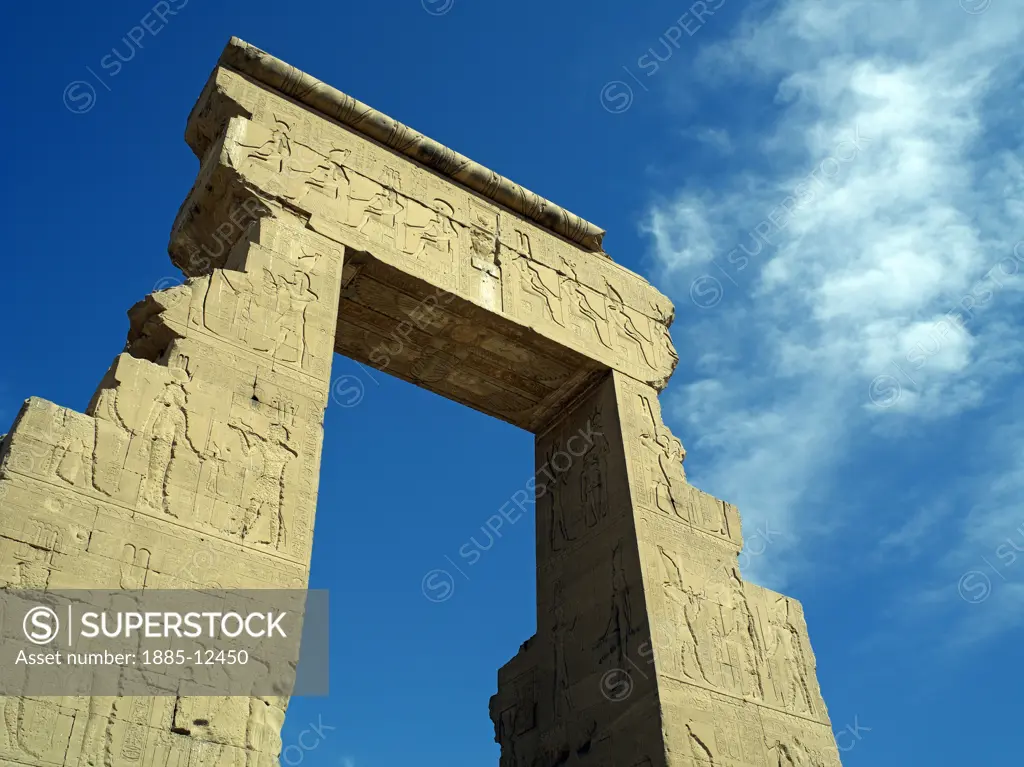 Egypt, , Dendara, Temple of Hathor - ruined arch against blue sky