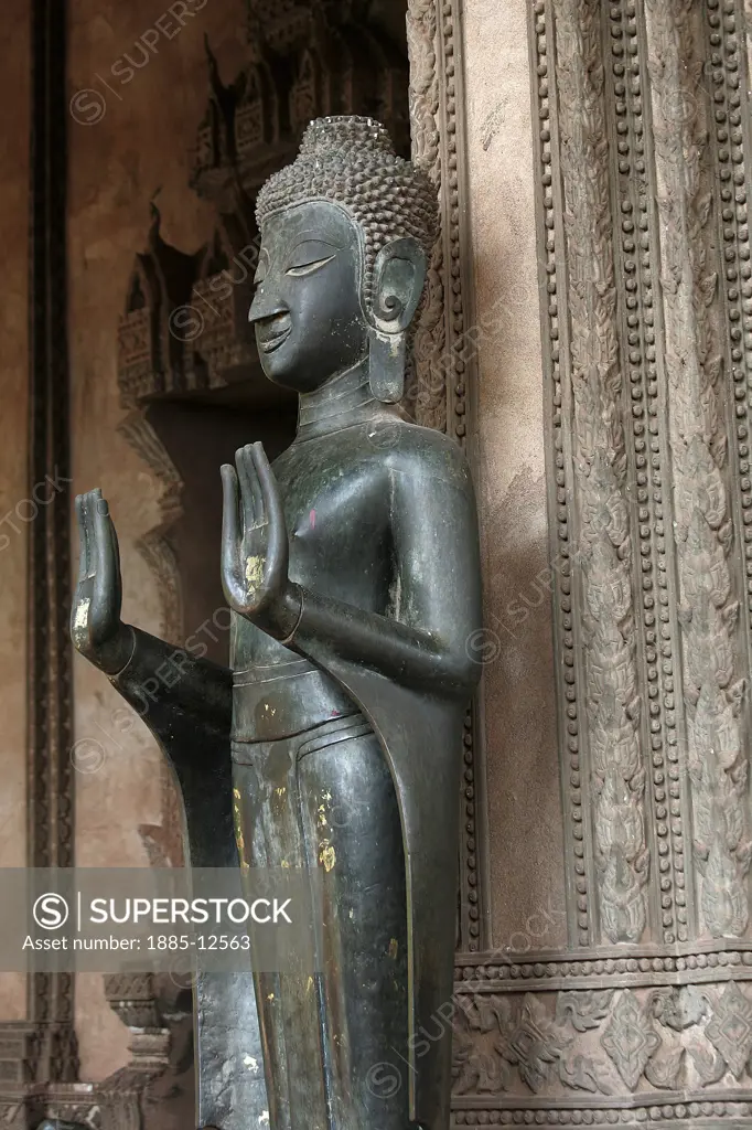Laos, , Vientiane, Bronze Buddha statue offering protection at Haw Pha Kaew 