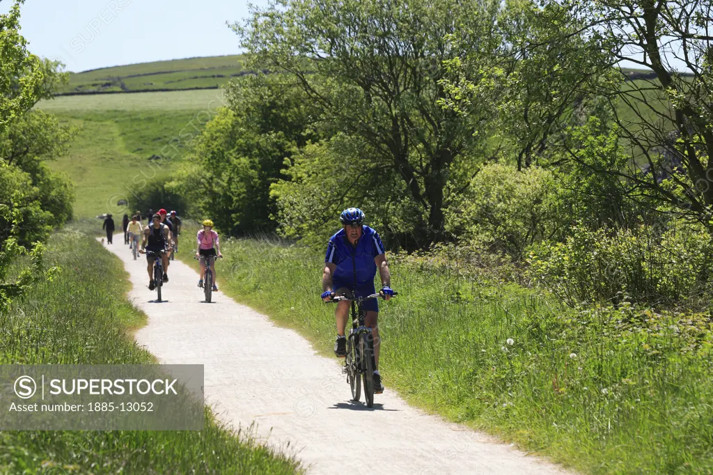 UK - England, Derbyshire, Hartington, Group of cyclists on the Tissington Trail