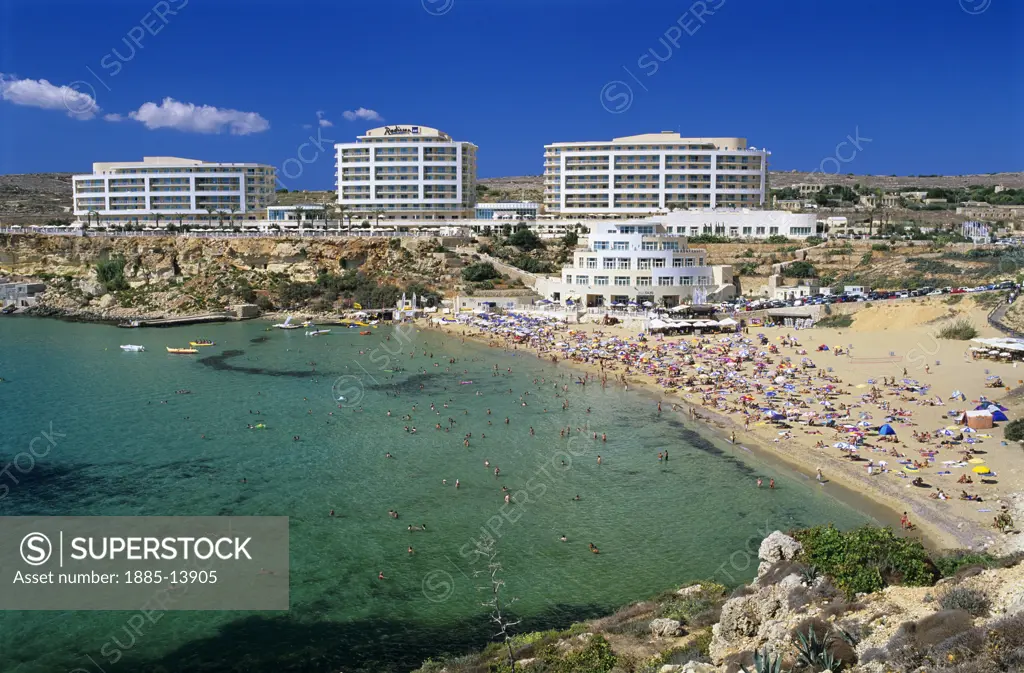 Maltese Islands, Malta, Golden Bay, View over busy beach and Radisson SAS Hotel