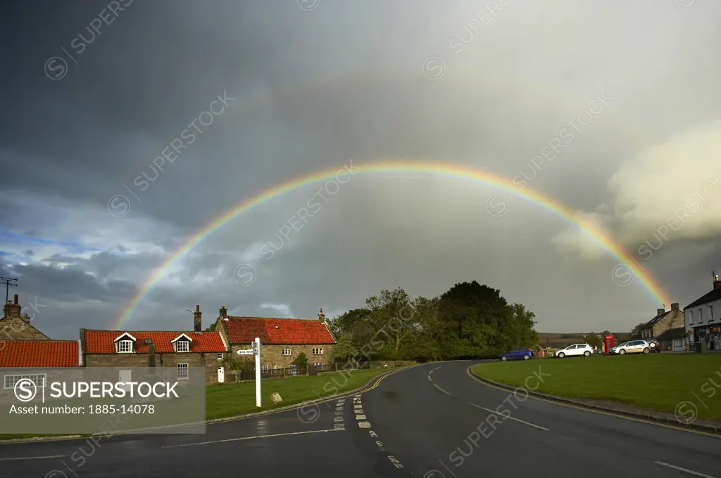 UK - England, Yorkshire, Goathland, Rainbow over village in North York Moors National Park