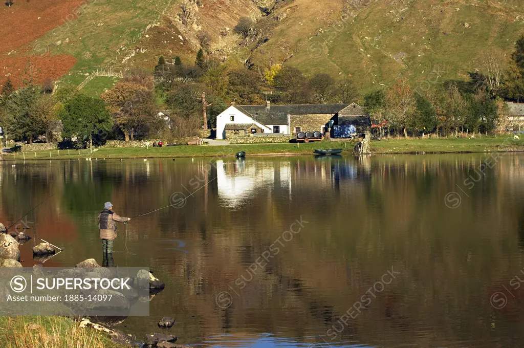 UK - England, Cumbria, Keswick - near, View across Watendlath Tarn in autumn with fisherman