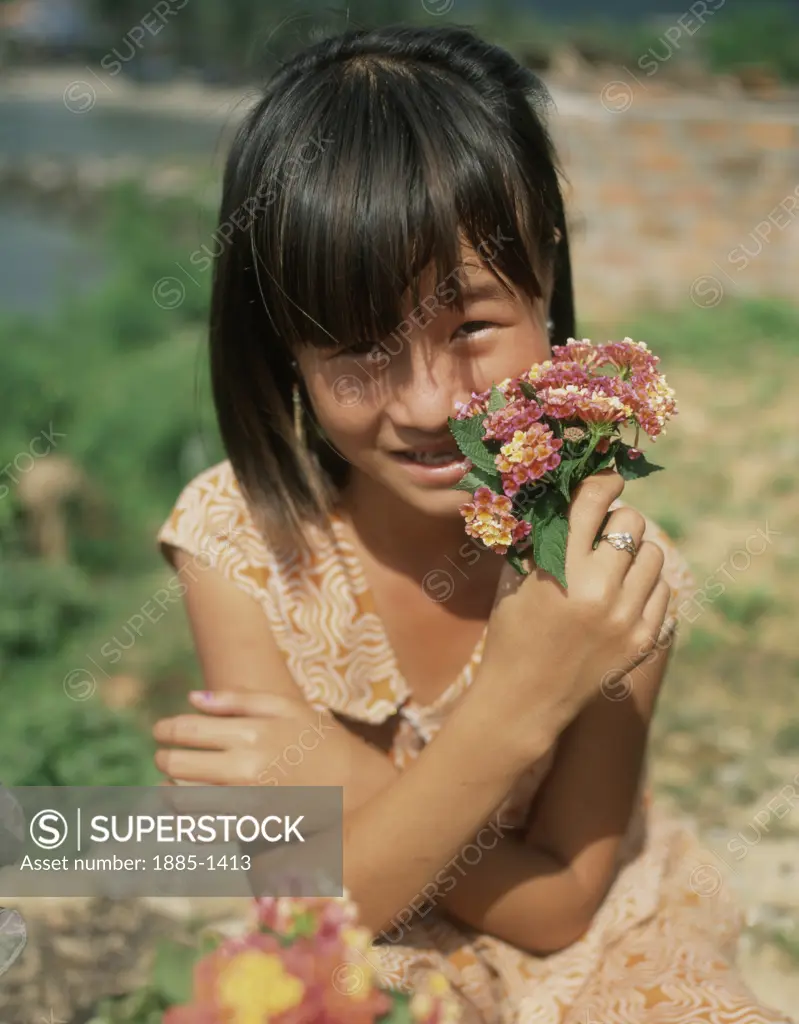 Vietnam, , General, Young girl holding posy of flowers