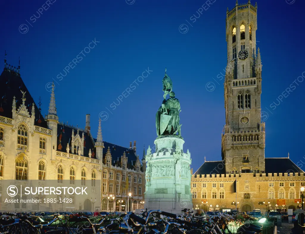 Belgium, Flanders, Bruges, The Grote Market at night with floodlit statue