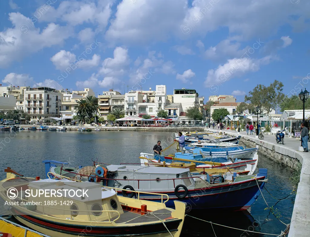 Greek Islands, Crete, Agios Nikolaos, View of Lake Voulismeni with fishing boats