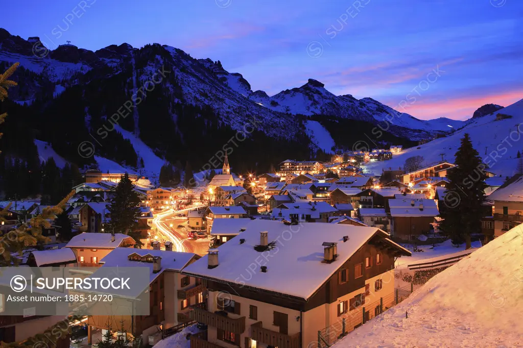 Italy, Trentino-Alto Adige, Arabba, Town and Dolomites at night in winter 