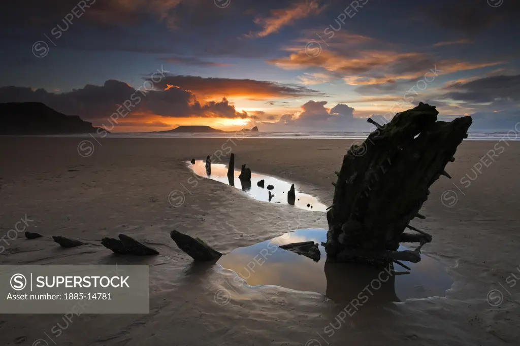 UK - Wales, Gower, Rhossili Bay, Beach at sunset with wreck of Helvetia and view to Worm's Head