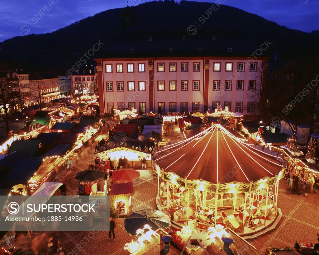 Germany, Baden Wurttemberg, Heidelberg, Christmas market  at night in University Square