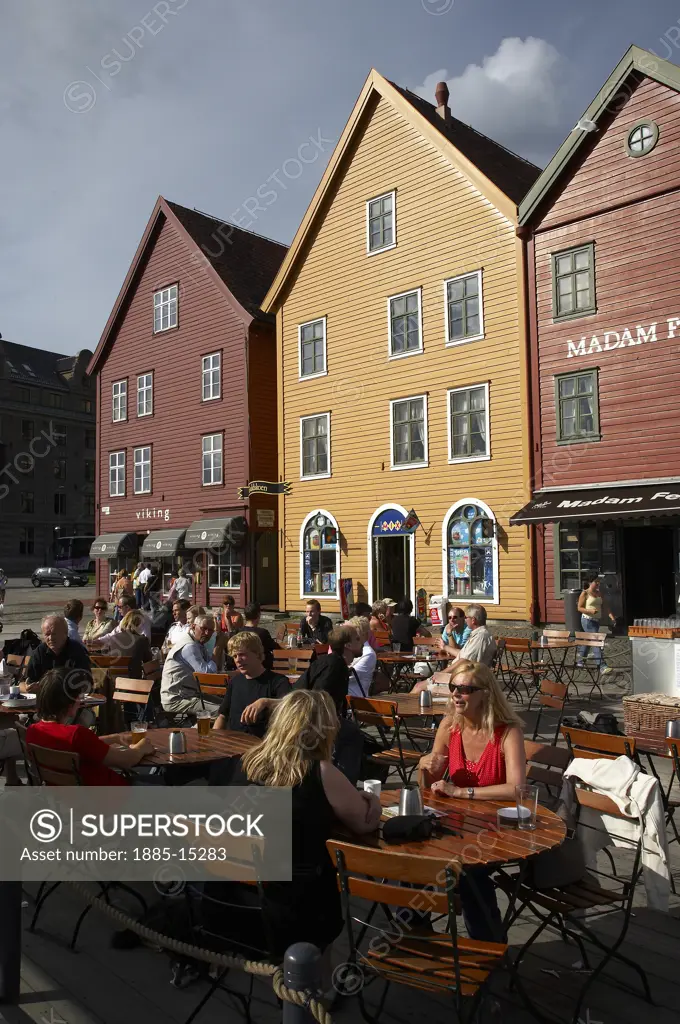 Norway, Hordaland, Bergen, Street cafe and wooden buildings at the Bryggen World Heritage Site