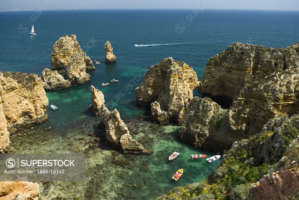 Portugal, Algarve, Lagos - near, Ponta da Piedade - rock formations and tourist boats