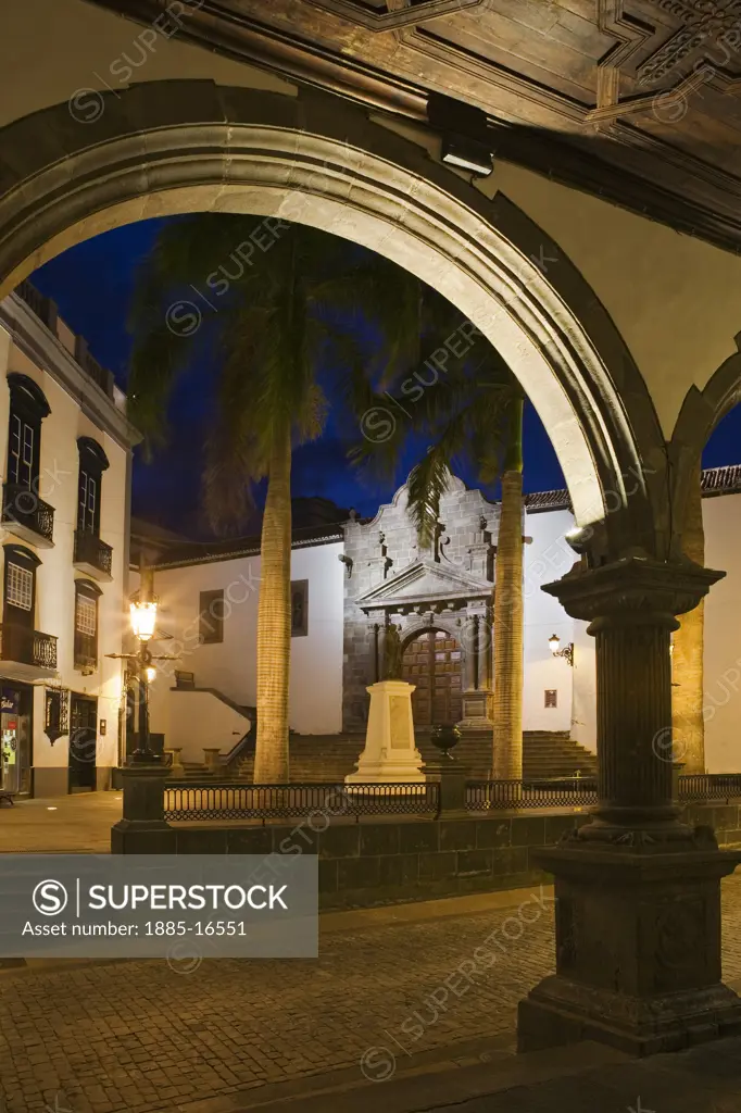 Canary Islands, La Palma, Santa Cruz, Plaza Espana at night viewed through archway