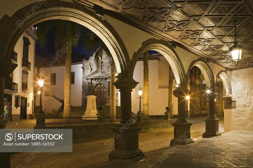 Canary Islands, La Palma, Santa Cruz, Plaza Espana at night viewed through arches
