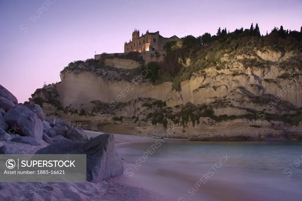 Italy , Calabria, Tropea, View of Santa Maria dell Isola from the beach at dusk