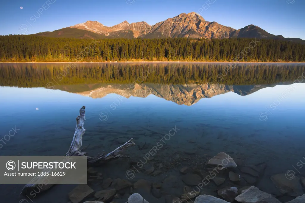 Canada, Alberta and The Rockies, Jasper National Park, Mountains and moon reflected in Patricia Lake