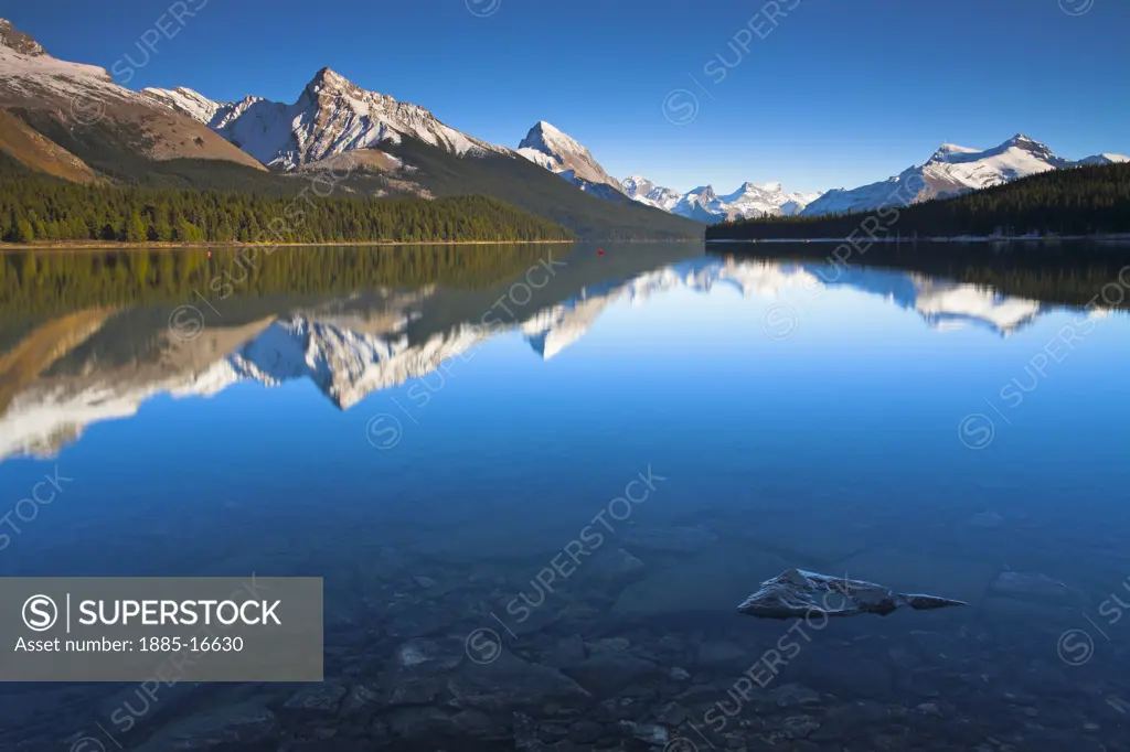 Canada, Alberta and The Rockies, Jasper National Park, Mountains reflected in Maligne Lake