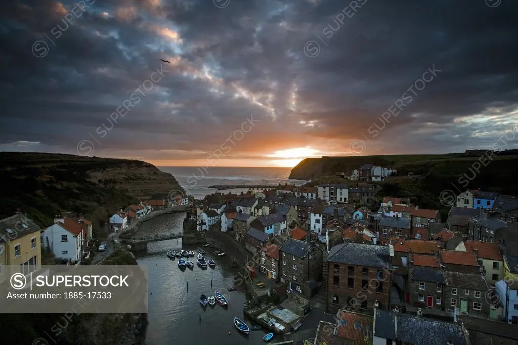 UK - England, Yorkshire, Staithes, View over fishing village from Cowbar Nab at dawn