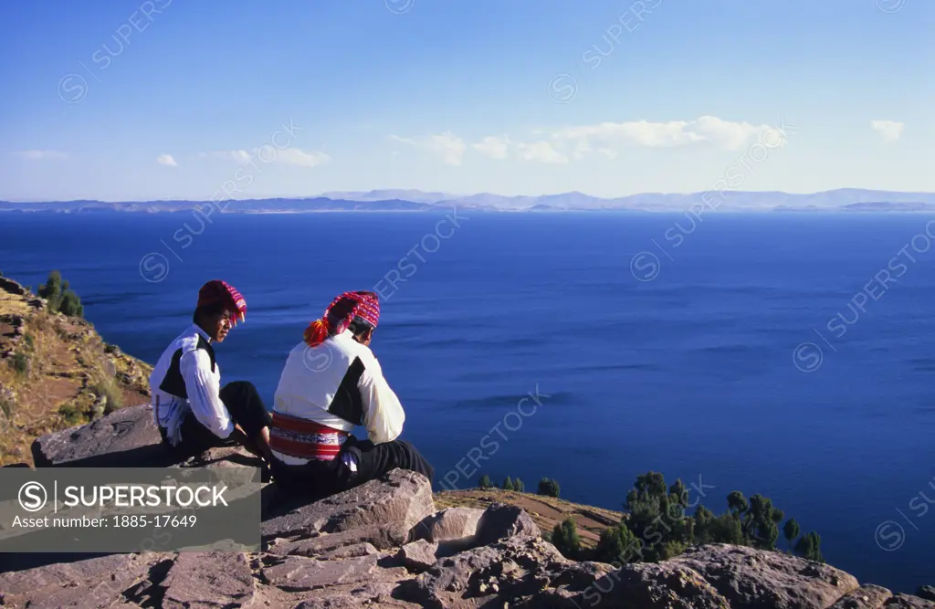 Peru, , Taquile Island, Local men by Lake Titicaca