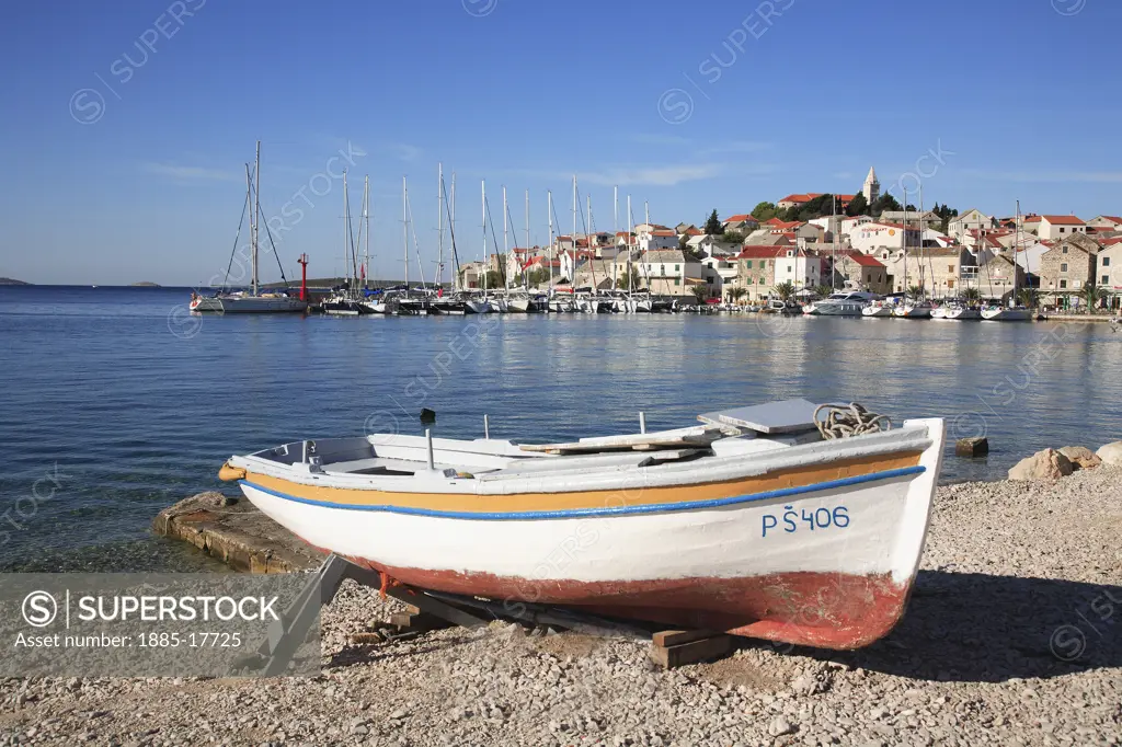 Croatia, Dalmatia, Primosten, View of town with boat on beach