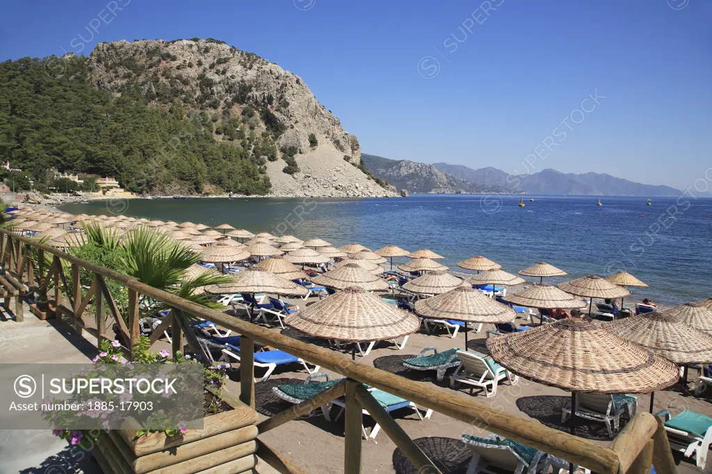 Turkey, Mediterranean, Turunc, Beach scene with sunshades