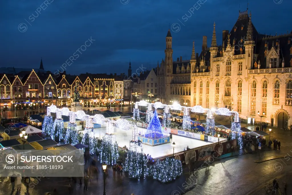 Belgium, Flanders, Bruges, View over the ice rink and Christmas Market 