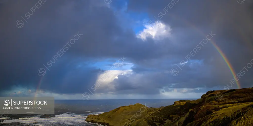 UK - England, Yorkshire, Whitby - near, Rainbow over sea at Kettleness Nab