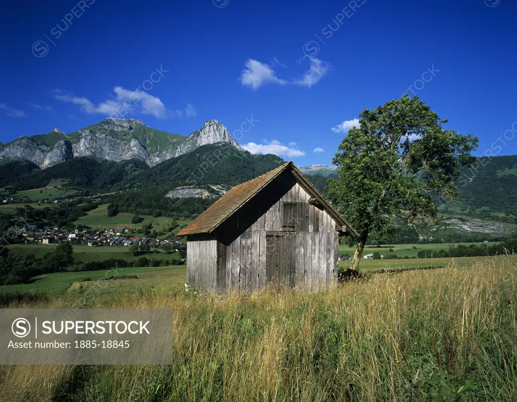 France, Rhone Alpes, Massif des Bauges National Park, Alpine scenery with barn