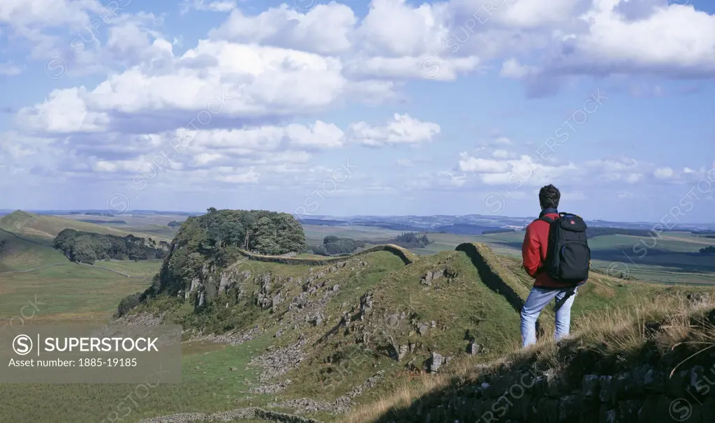 UK - England, Northumberland, Hadrians Wall, Hadrians Wall and hiker