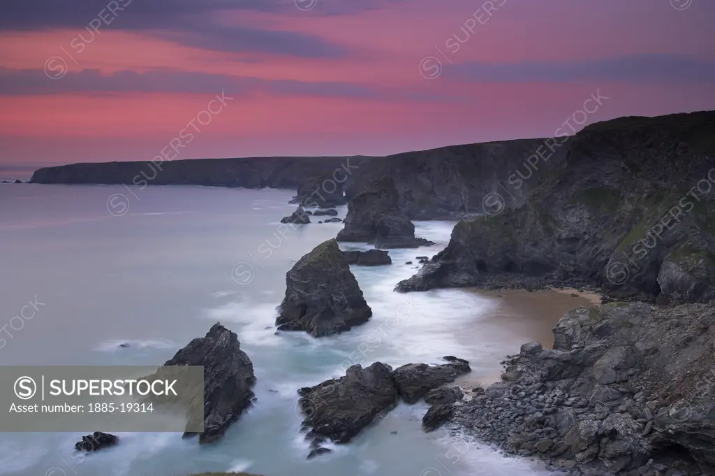 UK - England, Cornwall, Bedruthan Steps, Coastline scenery - rocks in sea at sunset