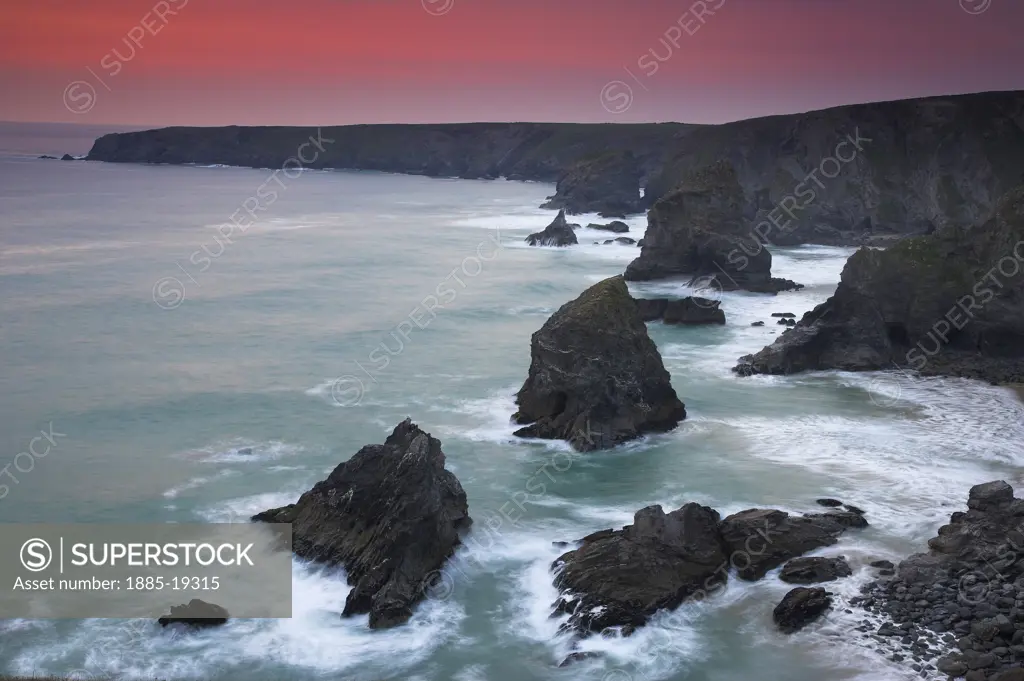 UK - England, Cornwall, Bedruthan Steps, Coastline scenery - rocks in sea at sunset