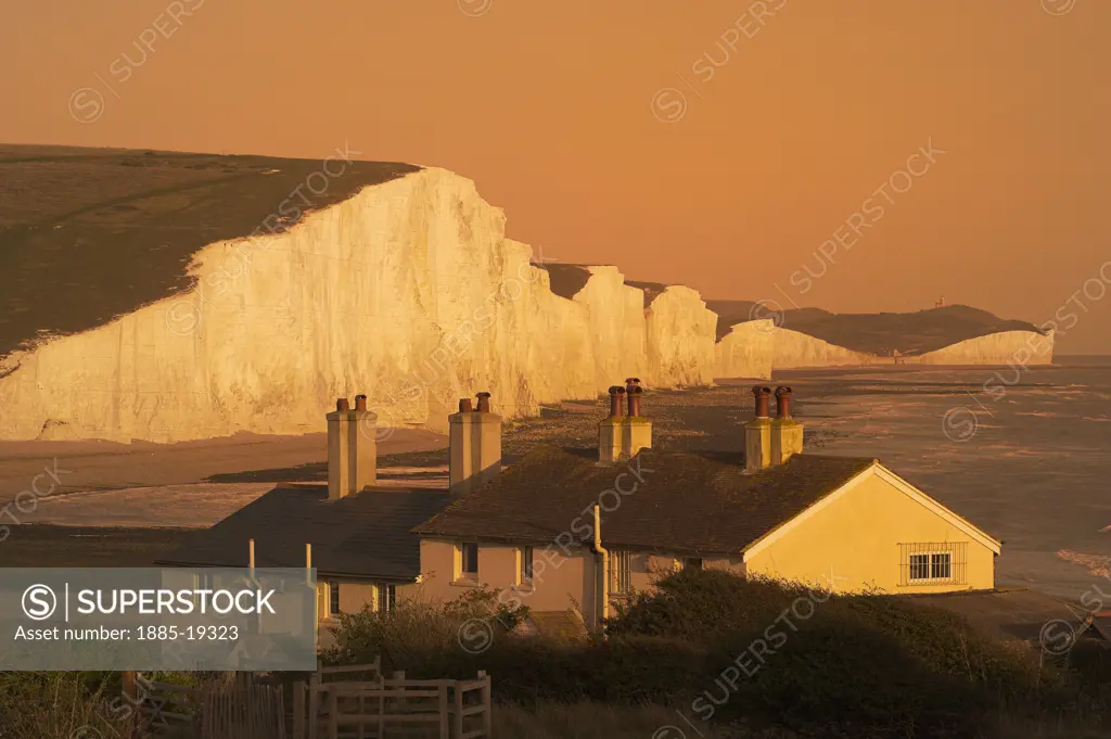 UK - England, East Sussex, Cuckmere, Coastguard cottages with Seven Sisters and Beachy Head