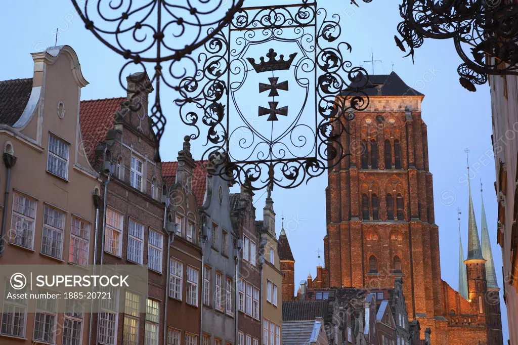 Poland, , Gdansk, Church of St Mary at dusk with signs and local architecture