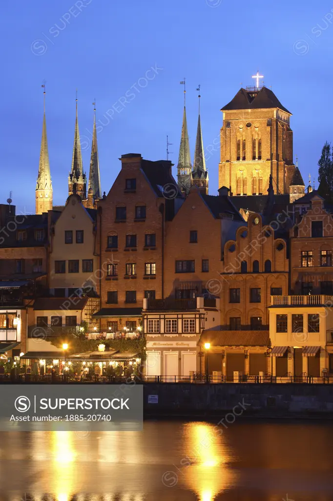 Poland, , Gdansk, City skyline and Church of St Mary with River Motlawa at night