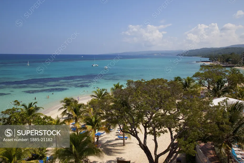 Caribbean, Jamaica, Ocho Rios, View of St Anns Bay over trees