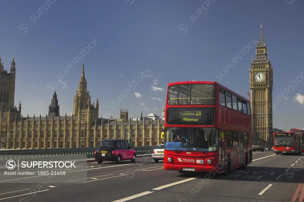 UK - England, London, London, London Red Buses crossing Westminster Bridge with Big Ben and the Houses of Parliament in the distance