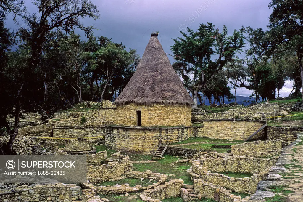 Peru, Pre Columbian Ruins predating Inca from Chachapoyan Civilization at Kuelap fortress - showing reconstructed ancient stone round house from original ruins