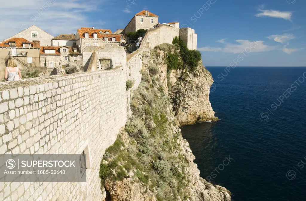 Croatia, Dubrovnik, Dubrovnik, A view along the city walls in Dubrovnik with the sea below