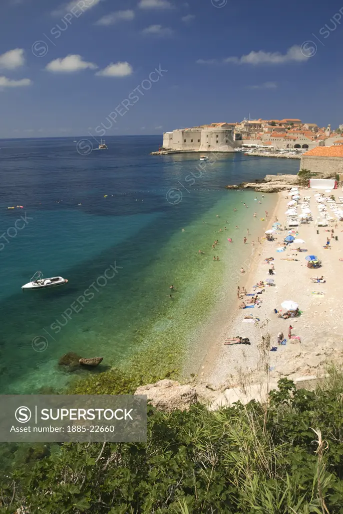 Croatia, Dubrovnik, Dubrovnik, A view of Dubrovnik beach with the old town in the distance