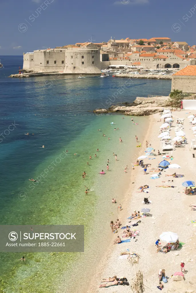 Croatia, Dubrovnik, Dubrovnik, A view of Dubrovnik beach with the old town in the distance