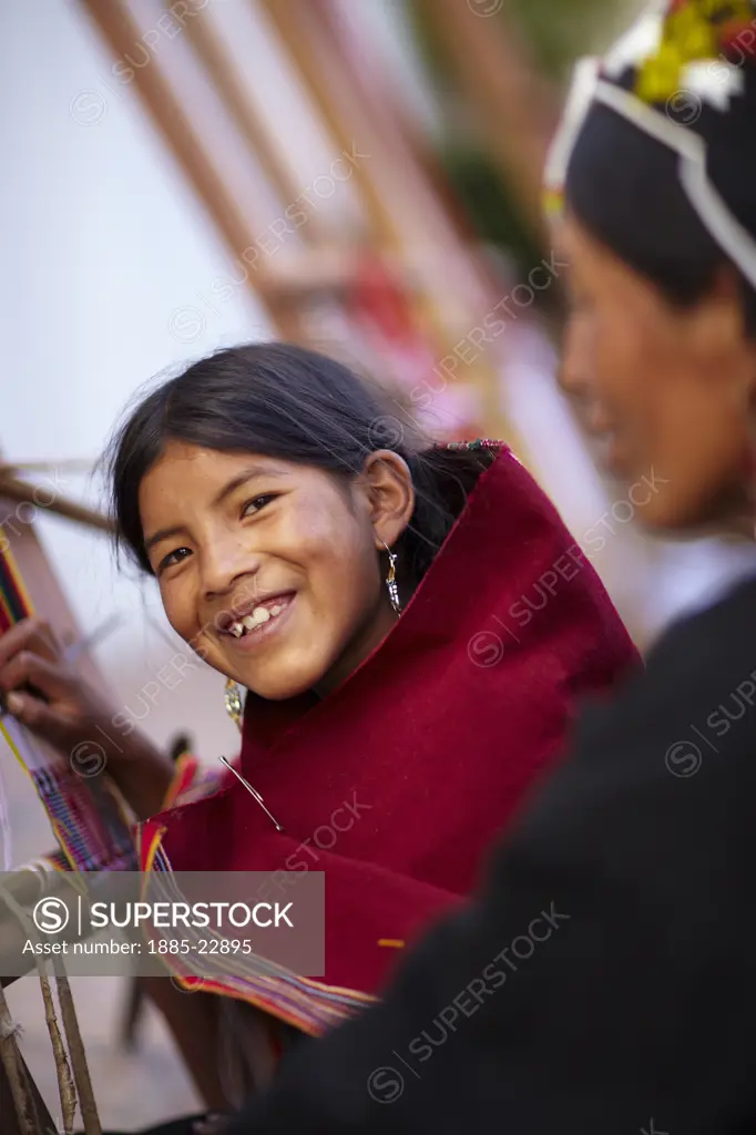 Bolivia, Sucre, A girl at a weaving school in sucre